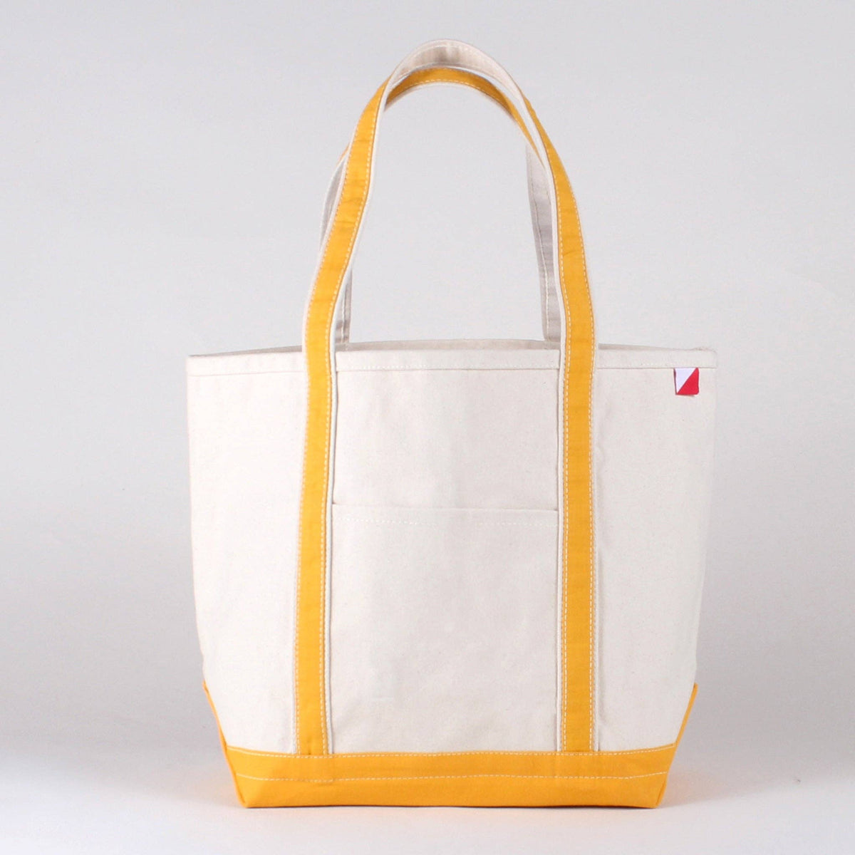 Personalized canvas tote in natural cream canvas with Canary trim, embroidered in San Antonio
