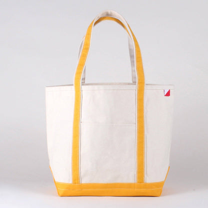 Personalized canvas tote in natural cream canvas with Canary trim, embroidered in San Antonio
