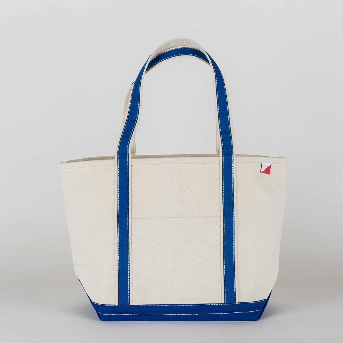 Personalized canvas tote in natural cream canvas with Cobalt trim, embroidered in San Antonio