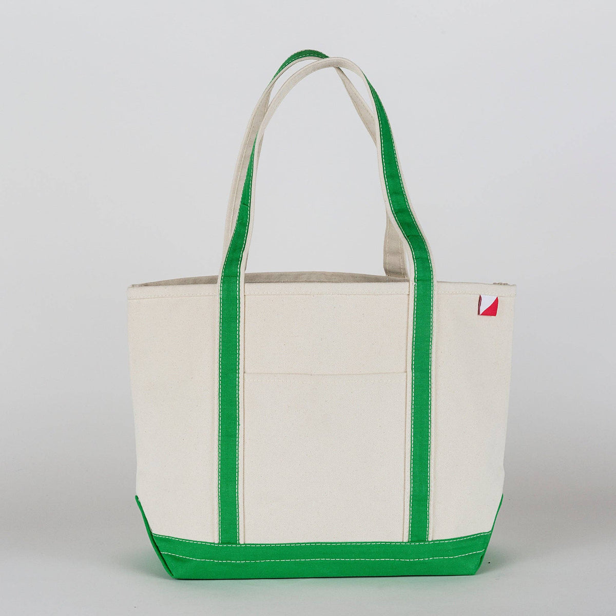 Personalized canvas tote in natural cream canvas with Green trim, embroidered in San Antonio