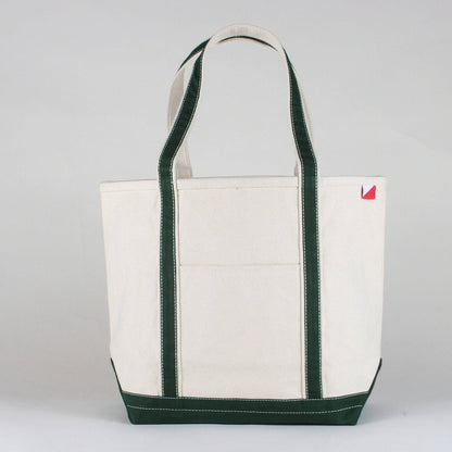 Personalized canvas tote in natural cream canvas with Hunter Green trim, embroidered in San Antonio