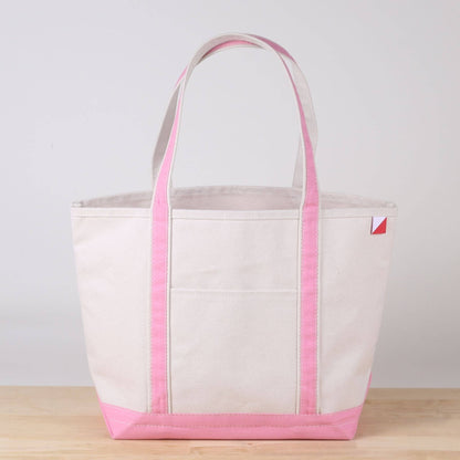 Personalized canvas tote in natural cream canvas with Light Pink trim, embroidered in San Antonio