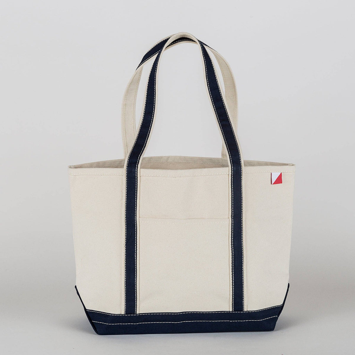 Personalized canvas tote in natural cream canvas with Navy trim, embroidered in San Antonio