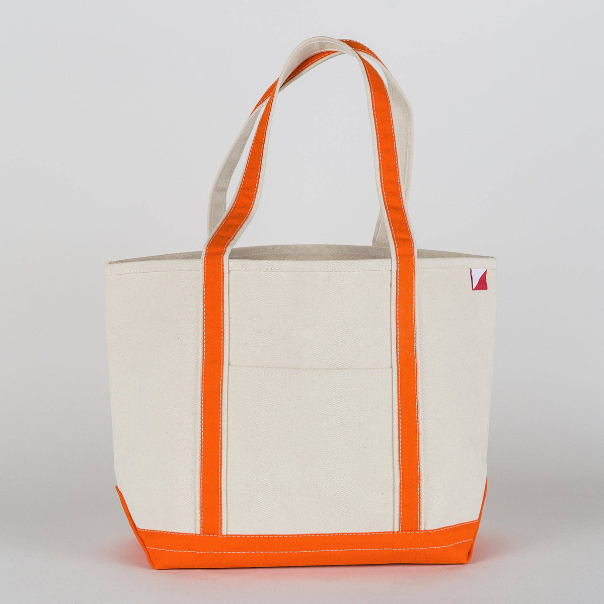 Personalized canvas tote in natural cream canvas with Orange trim, embroidered in San Antonio