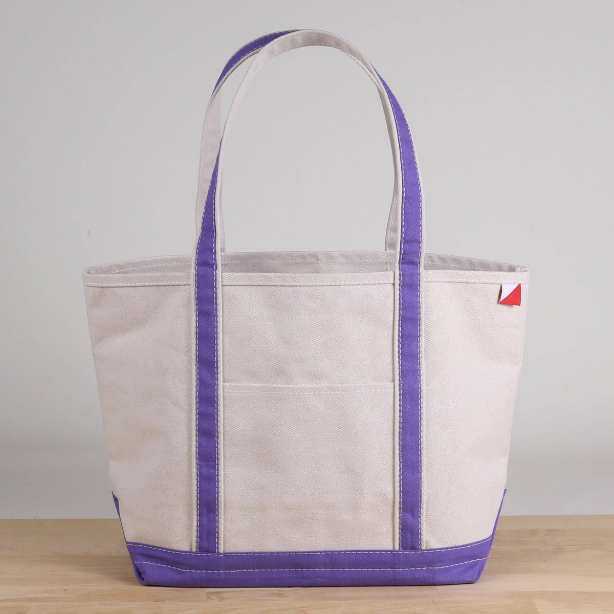 Personalized canvas tote in natural cream canvas with Purple trim, embroidered in San Antonio
