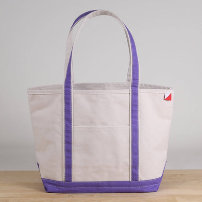 Personalized canvas tote in natural cream canvas with Purple trim, embroidered in San Antonio