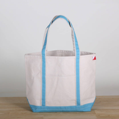 Personalized canvas tote in natural cream canvas with Surf trim, embroidered in San Antonio